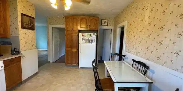 Image 4: Pantry with an eat in kitchen dining area