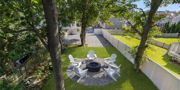 Image 3: Common Back Yard virtually staged with fire pit