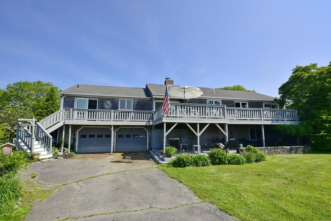 Image 3: Rear driveway and garage/deck entry.