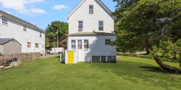 Image 4: Back of house showing bulkhead access to basement