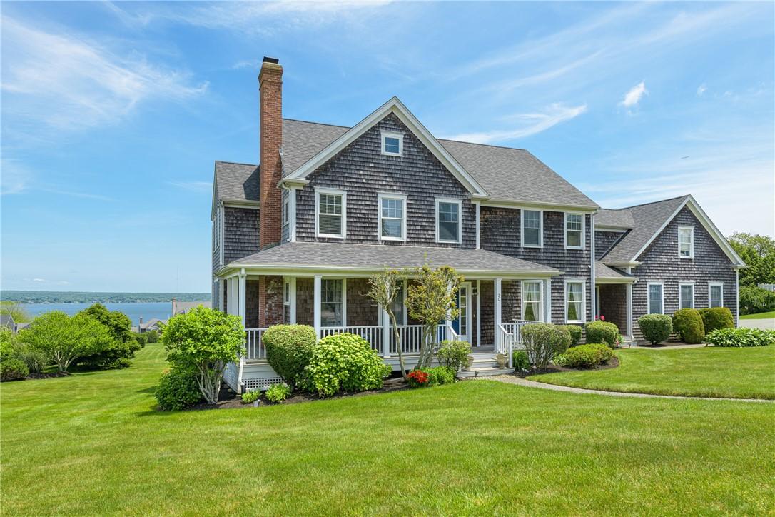 Image 1: Front of home with waterviews.