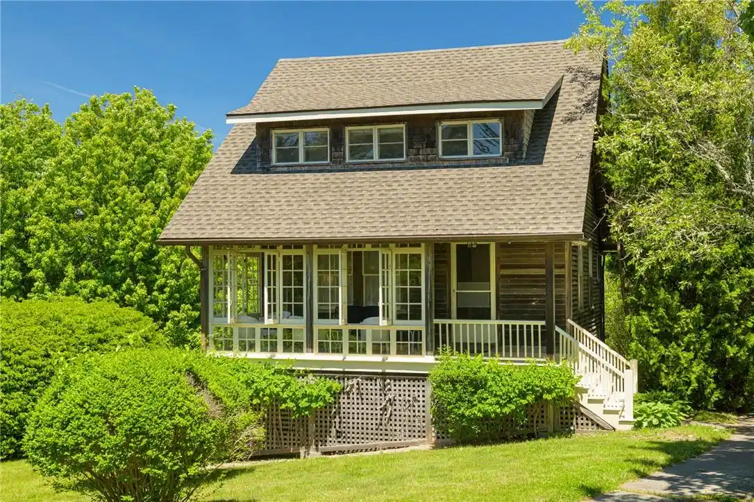 Image 1: On the .66 acre lot is Breezecote, a carriage hous
