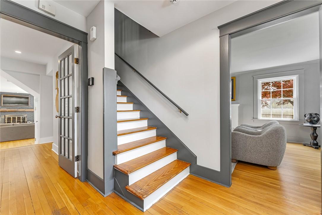 Image 4: Stairwell off of Foyer Leads to 3 Bedrooms, Full B