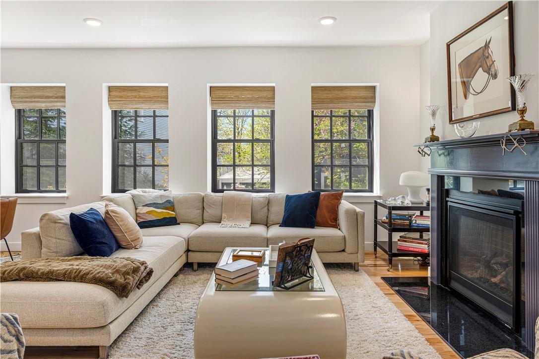 Image 3: Living room with gas fireplace.