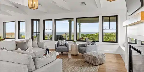 Image 3: 9' ceiling, walls of windows, gas fireplace