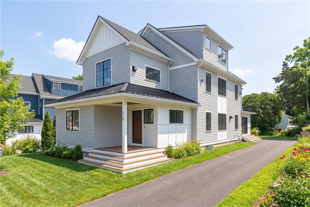 Image 2: Side View of Existing Home with Virtual Landscapin
