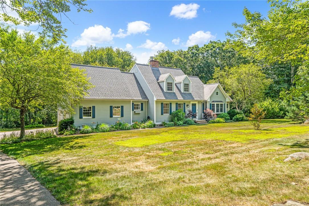 Image 3: House features mature plantings and perennials