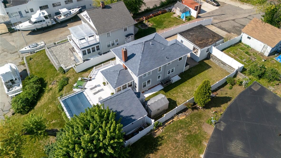 Image 2: A detached garage, beautifully fenced grounds and