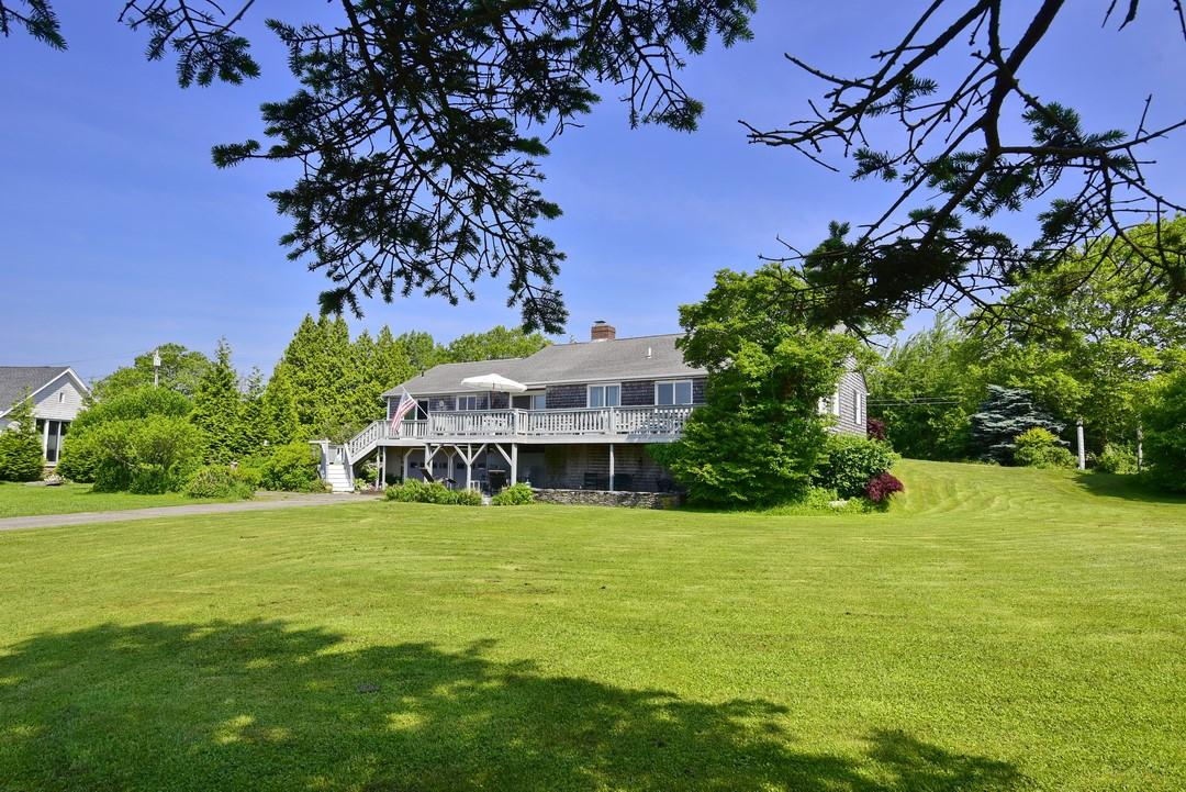 Image 3: South facing view of deck and garage entry