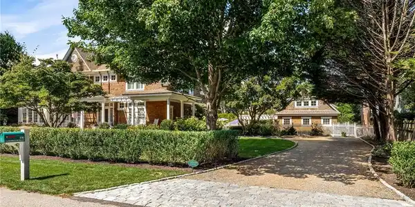 Image 3: Driveway entry showing residence to the left, and