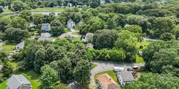 Image 3: Back view of home with double lot