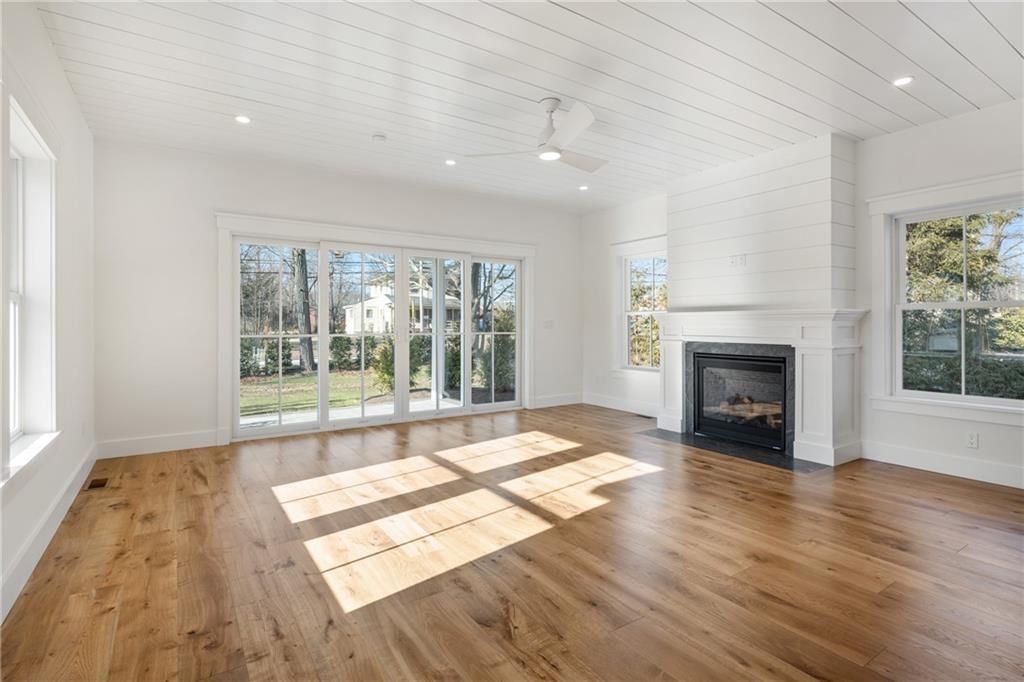 Image 4: Family Room with 7 1/2 white inch flooring, gas fi