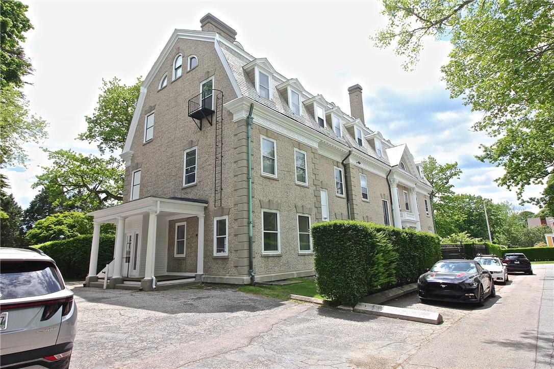 Image 3: Front & Driveway to Parking & Back Door