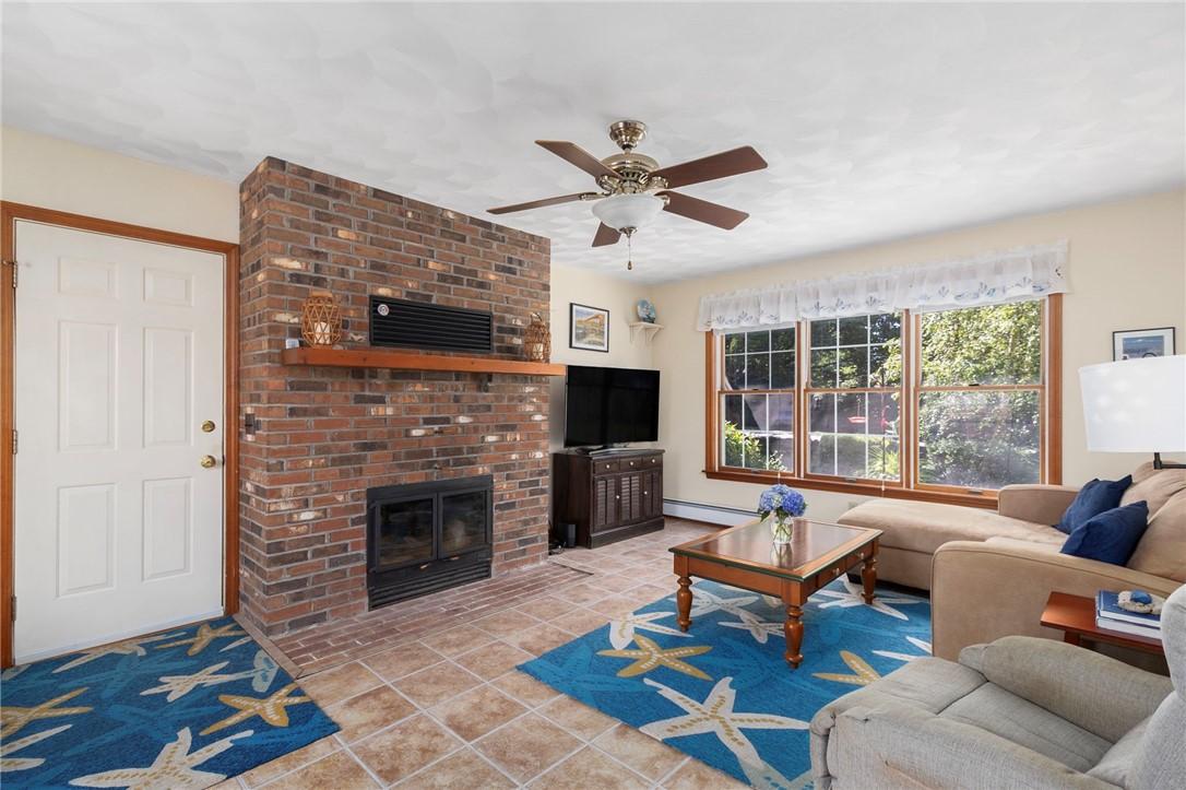 Image 3: Family room with wood stove (off garage)