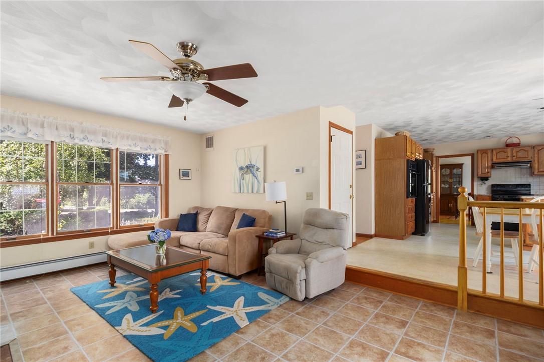 Image 4: Family room with wood stove (off garage)