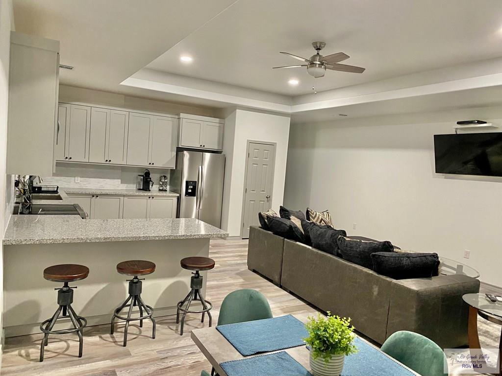 Image 3: Upstairs Kitchen/ Living Room/ Dining