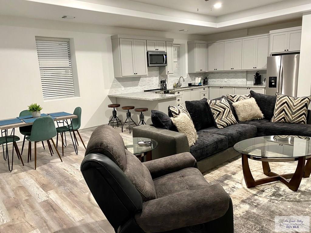 Image 4: Upstairs Kitchen/ Living Room/ Dining