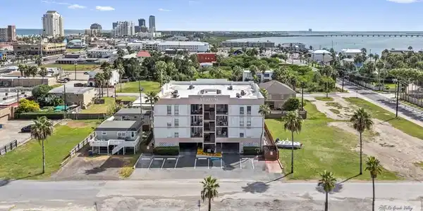 Image 2: Atrium Condominiums, Located in the heart of the South Padre Island Entertainment District. Short walk to entertainment, Gravity Park, restaurants, Boardwalk and seasonal firework displays.