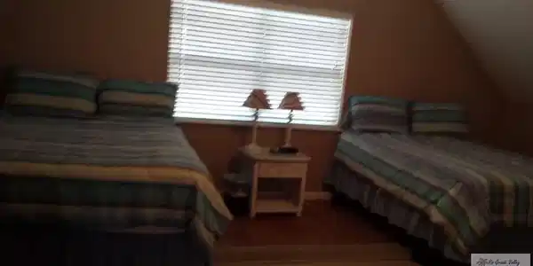 Image 4: Unit 1 upstairs primary bedroom