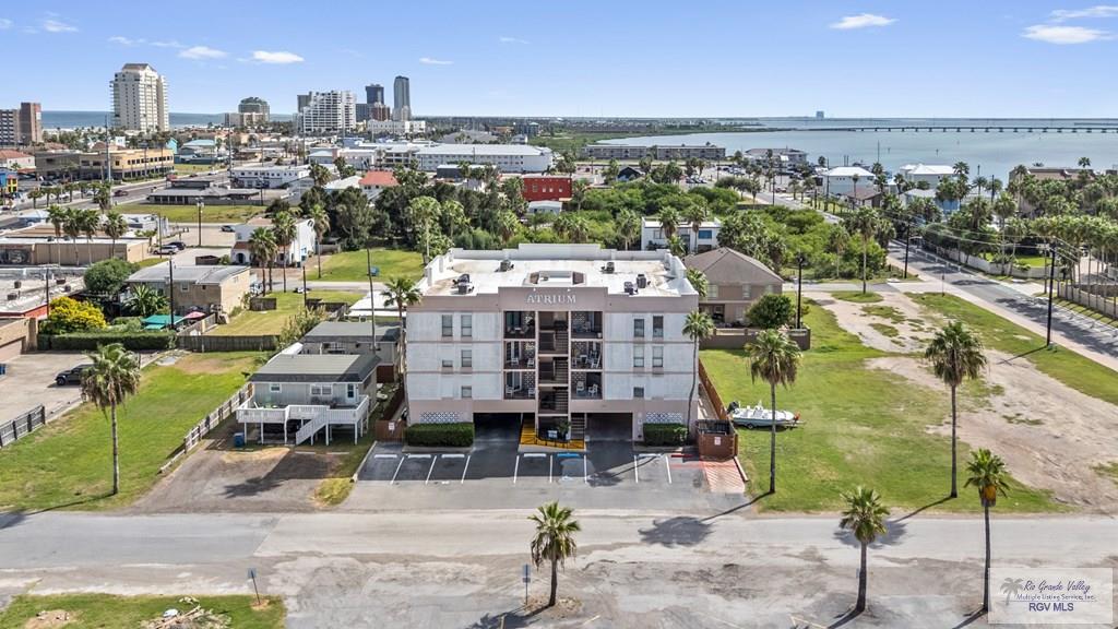 Image 2: Atrium Condominiums, Located in the heart of the South Padre Island Entertainment District. Short walk to entertainment, Gravity Park, restaurants, Boardwalk and seasonal firework displays.