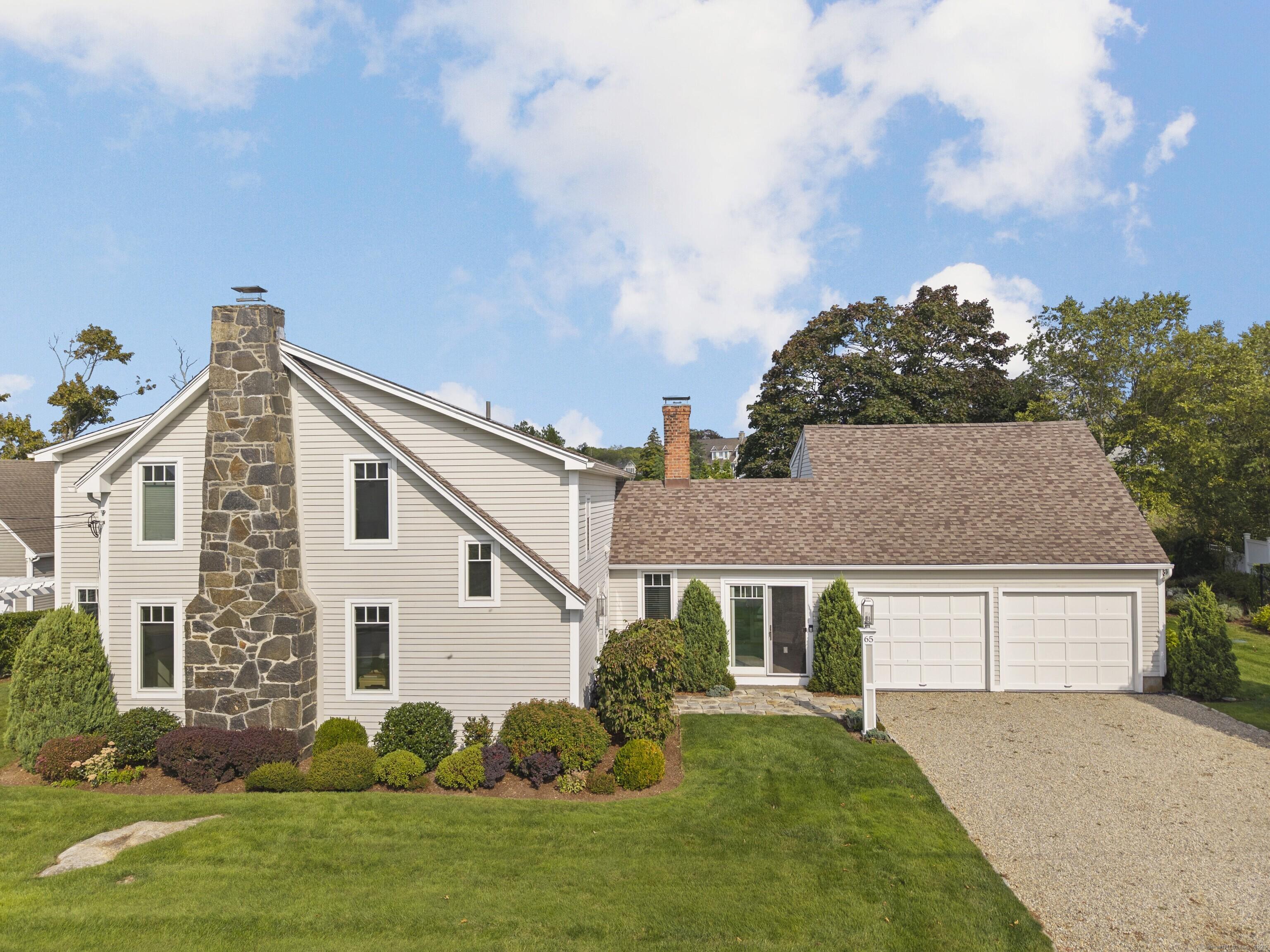 Image 2Front of House: This home sits perfectly on the lot, surrounded by beautiful homes with Long Island Sound views from the front and South Bay views from the rear.