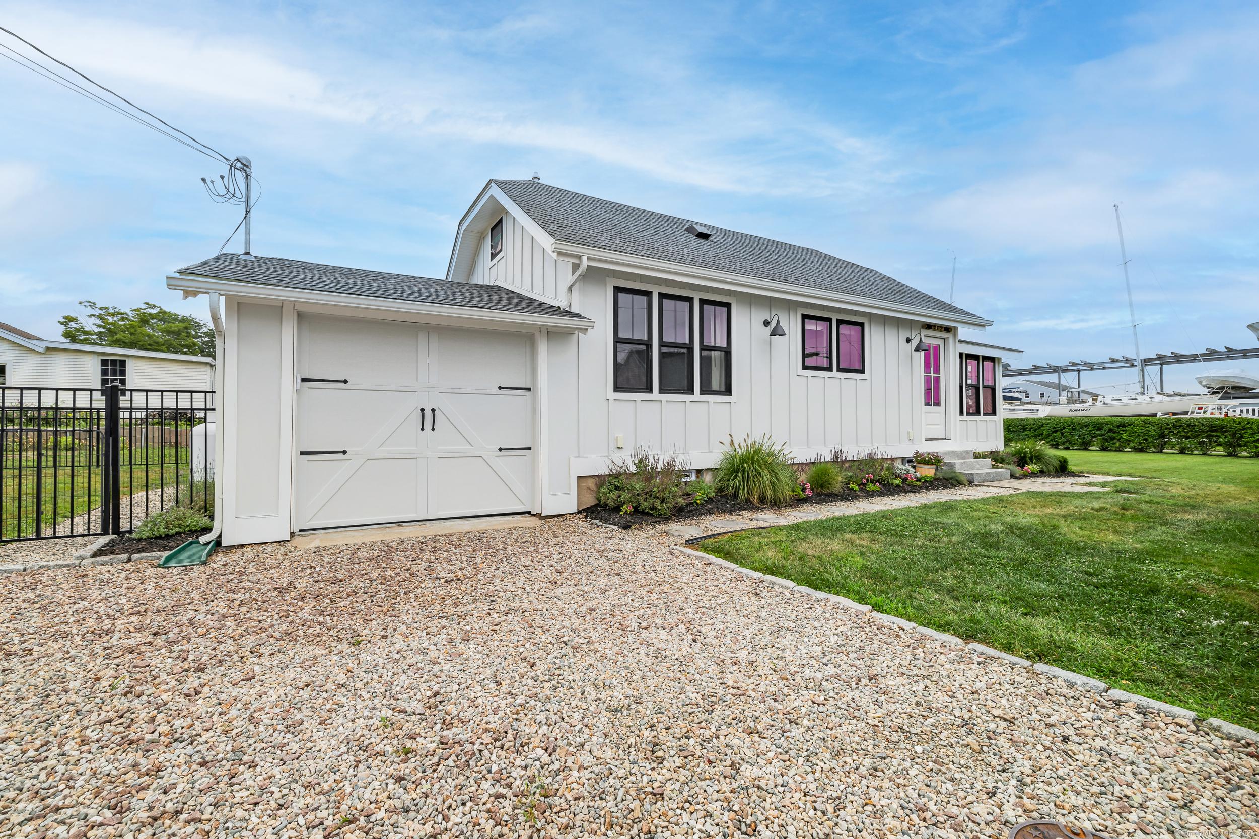 Image 2Front of House: WELCOME HOME... A rare opportunity to own this coastal gem! PRIME location, better than NEW, custom designed and built from ground up.