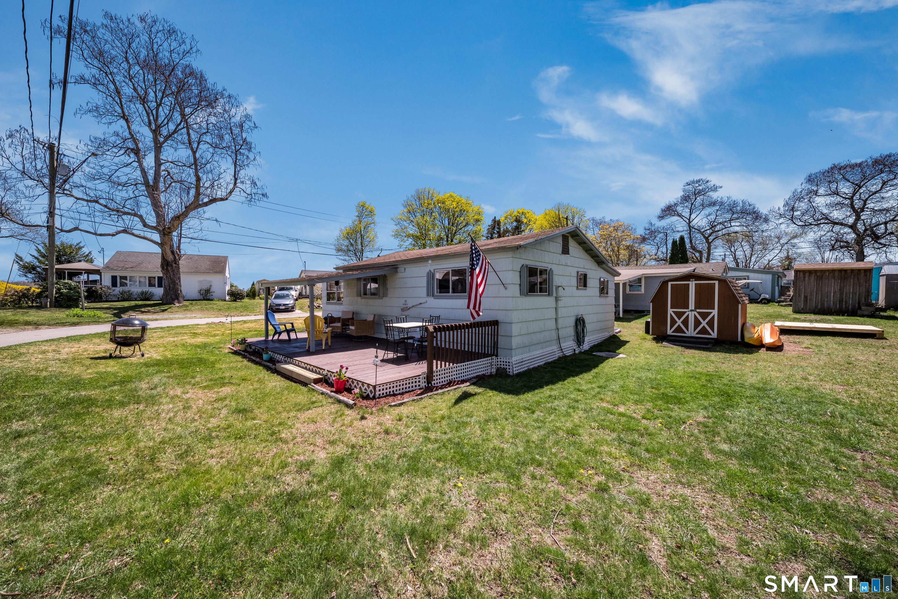 Image 4: Backyard equip with a storage shed and outdoor shower!