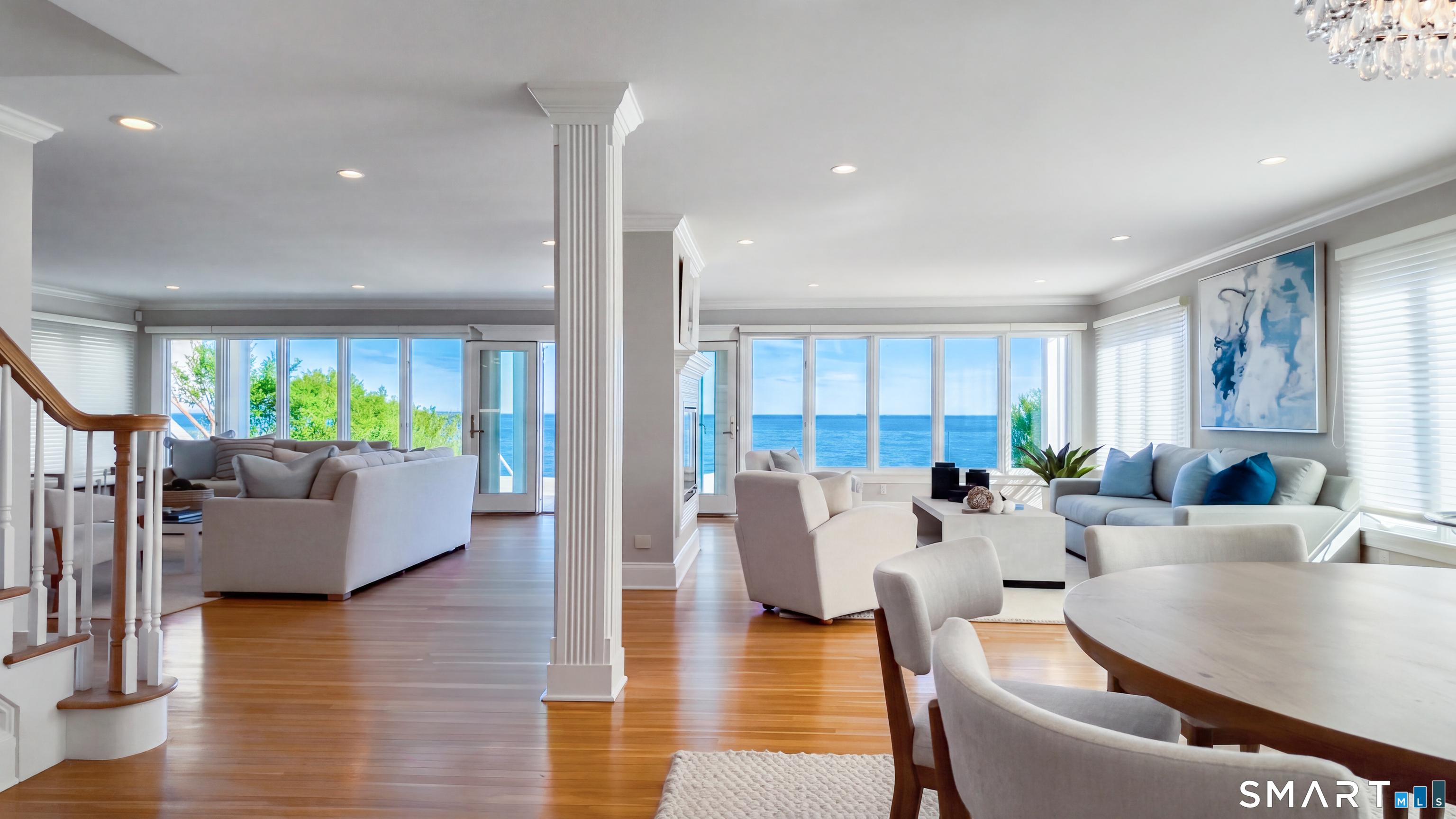 Image 3: WIDE OPEN floor plan provides gorgeous 180 like degree views all day.....Dining room shown to the right w/ round table, however fits a larger farm table w/ seating for 10-12 easily (ask to see photo)