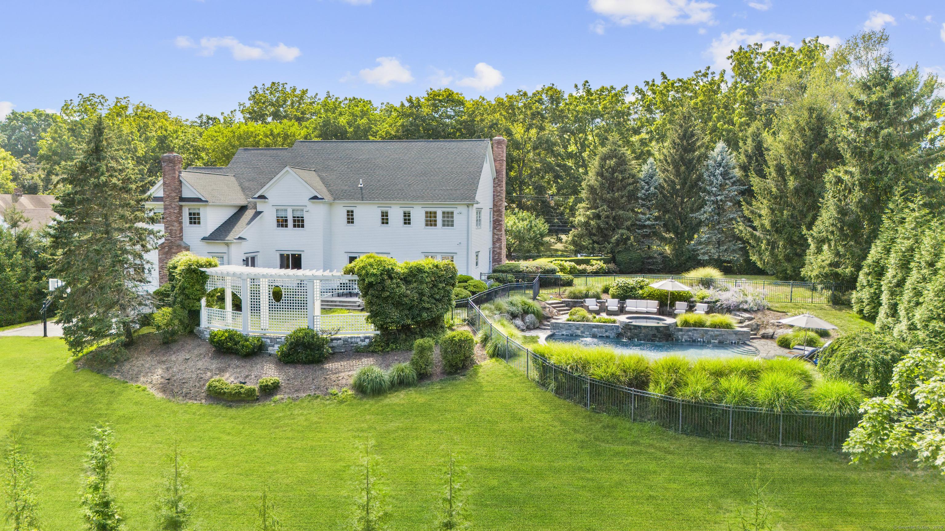 Image 2: Beautiful grounds with lush lawns, gunite pool and spa