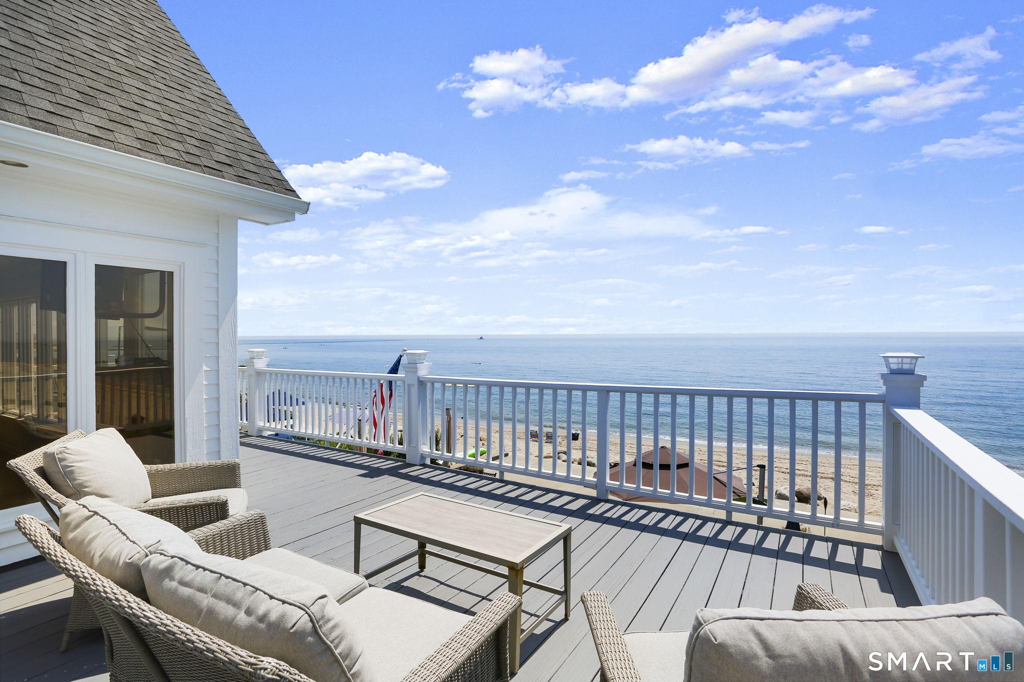 Image 2: Wrap around deck provides the best views, thoughtfully designed by builder/owner so not only Primary, but 2 other bedrooms face face the water! A smart cascading design, so all have their own views.....