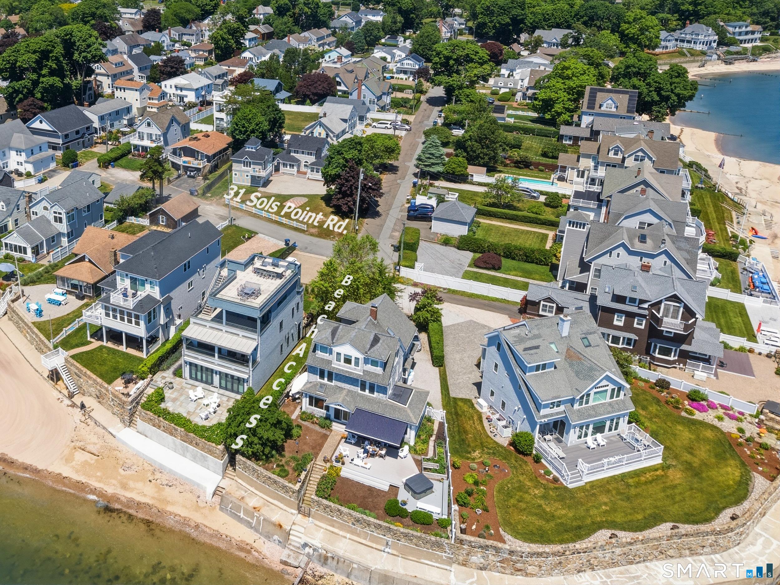 Image 1Aerial View: Renovated home on a .25-acre corner lot, steps from a private beach.