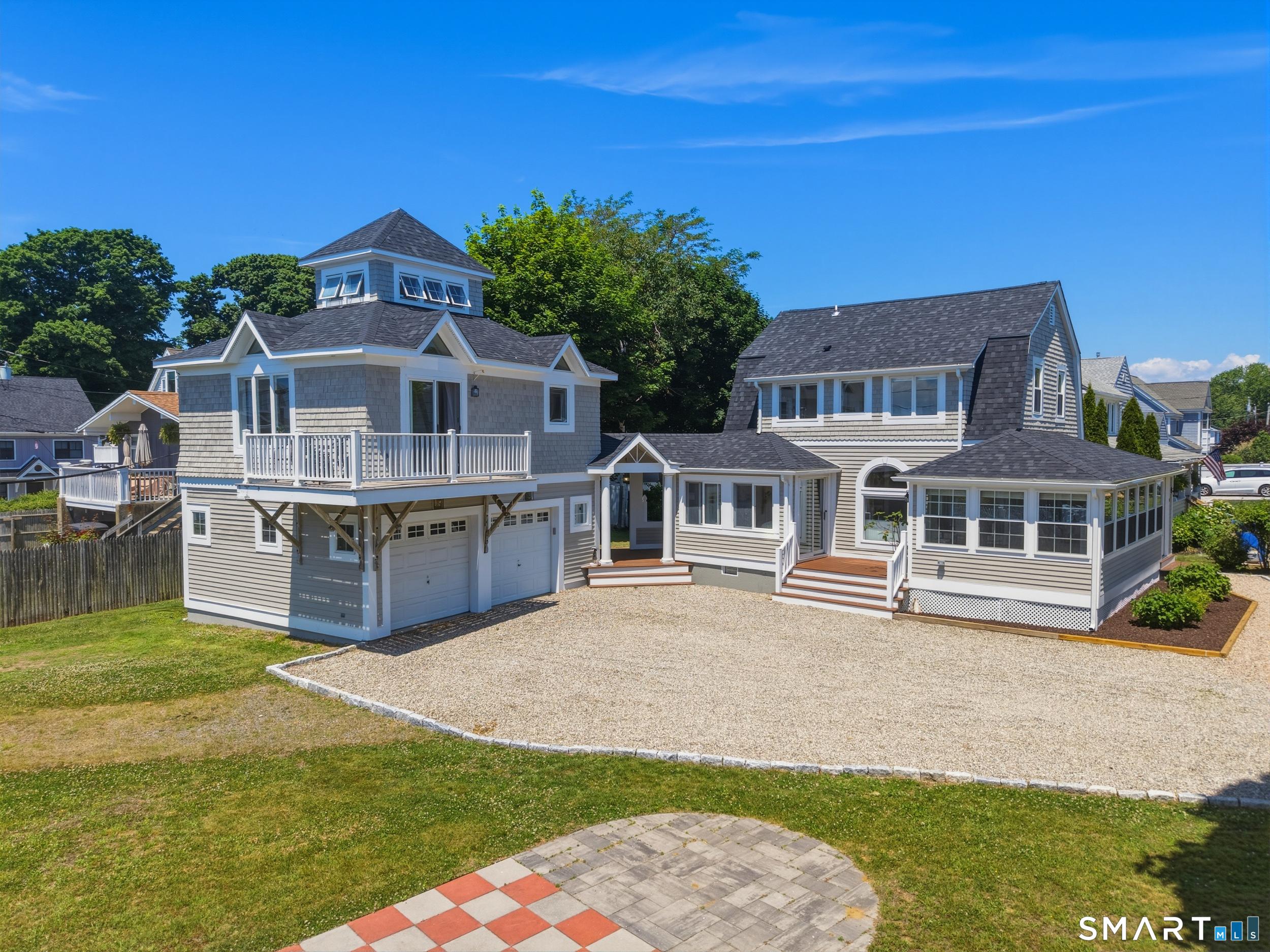 Image 2Front of Structure: WELCOME HOME... This fully renovated property features a 2-bedroom, 2-bath main house, plus a studio apartment above the garage offering flexible space for guests, a home office, or income potential.