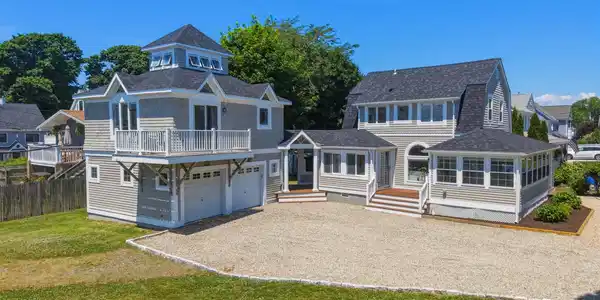 Image 2Front of Structure: WELCOME HOME... This fully renovated property features a 2-bedroom, 2-bath main house, plus a studio apartment above the garage offering flexible space for guests, a home office, or income potential.