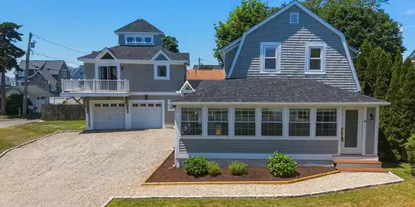 Image 3Front of House: Recent updates include new roof, energy-efficient HVAC, tankless hot water, and fresh interior/exterior paint. The detached 2-car garage includes an efficiency apartment above; perfect for guests, private office space, studio, or rental income.