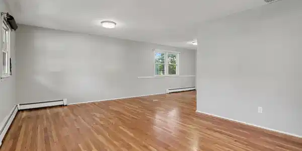 Image 3Living Room: View from stairs toward Dining Room - around corner