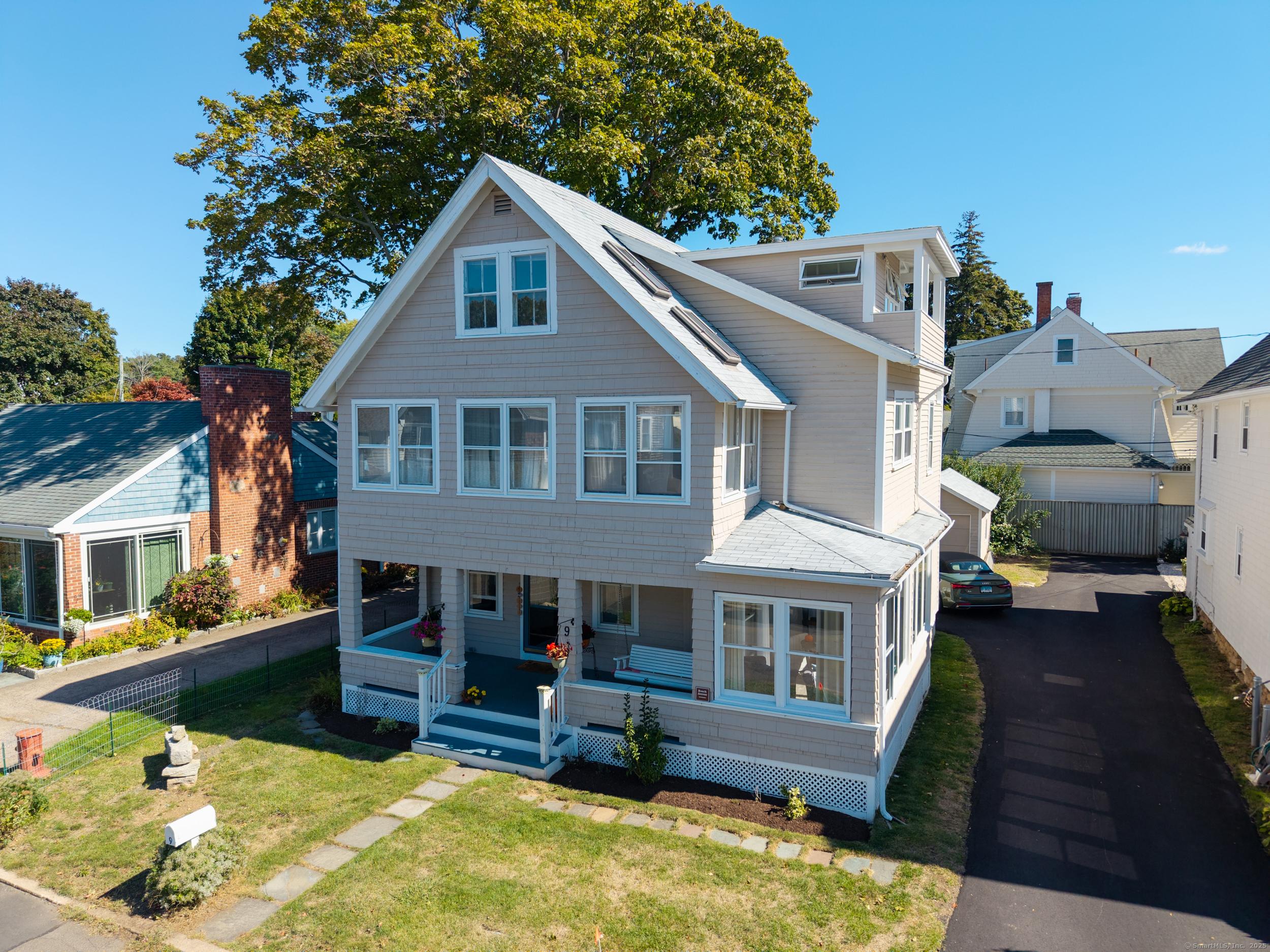 Image 2Back of Structure: WELCOME HOME... nestled on a quiet, private dead-end street, this year-round, New England-style home is the perfect retreat for water lovers or those seeking a second home.