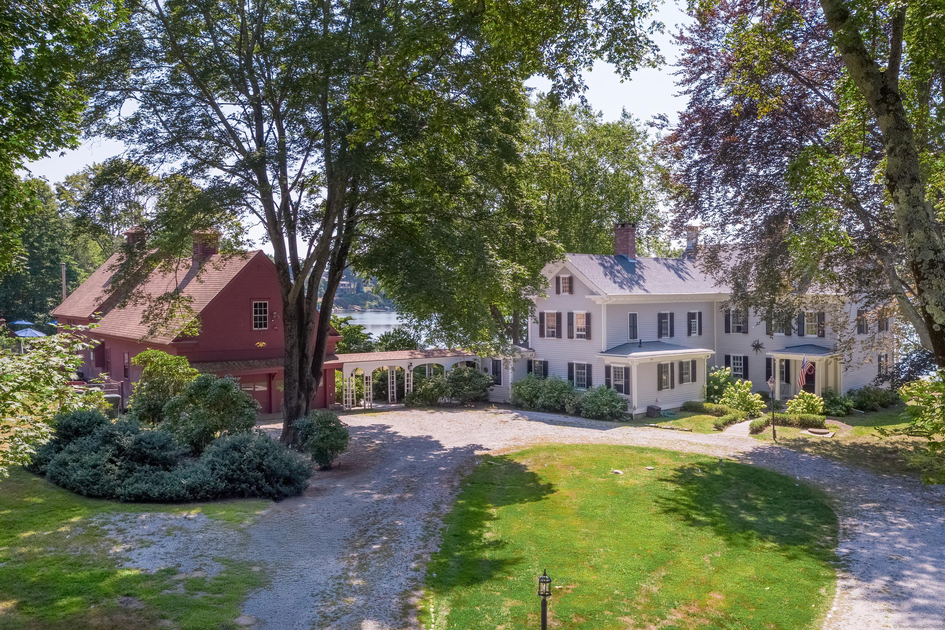 Image 2Front of House: Circular driveway leads to the main house and barn.