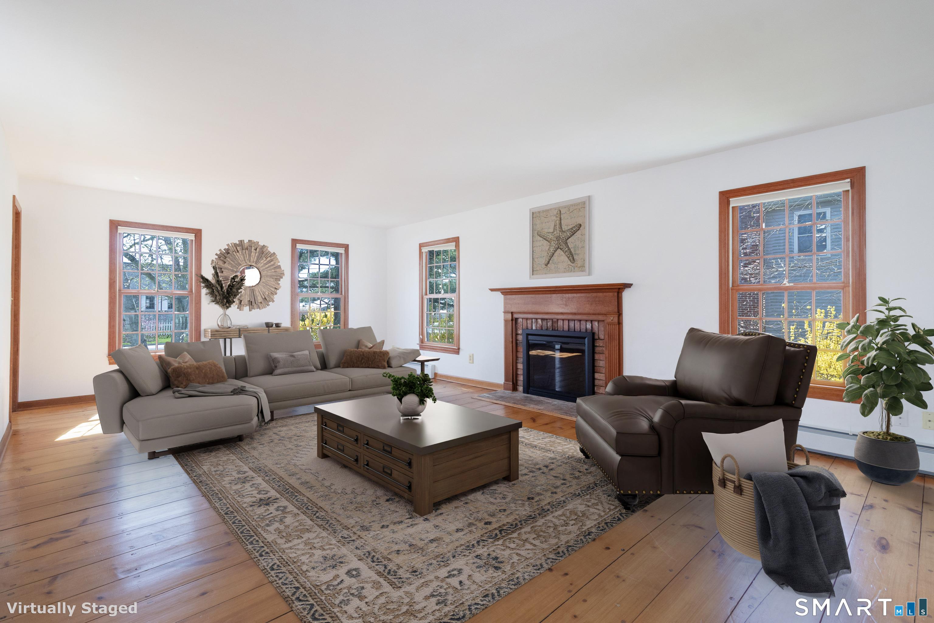 Image 3: Formal living room with wood burning fireplace, currently it is capped and has an electric log set, but can be turned back. 