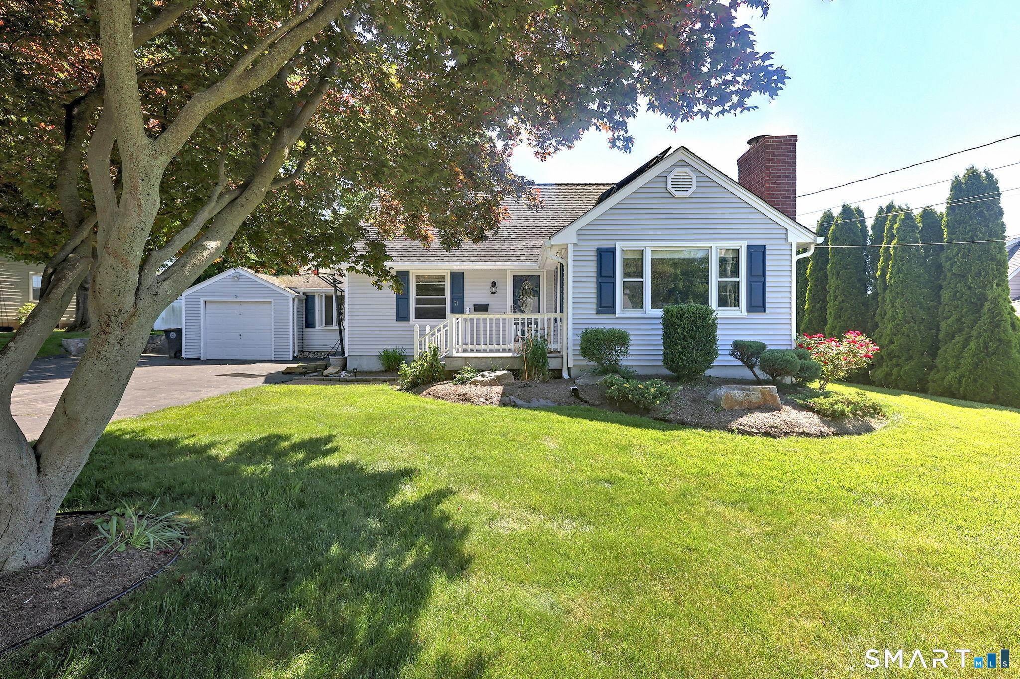 Image 2Front of House: Welcoming curb appeal with landscape and front porch