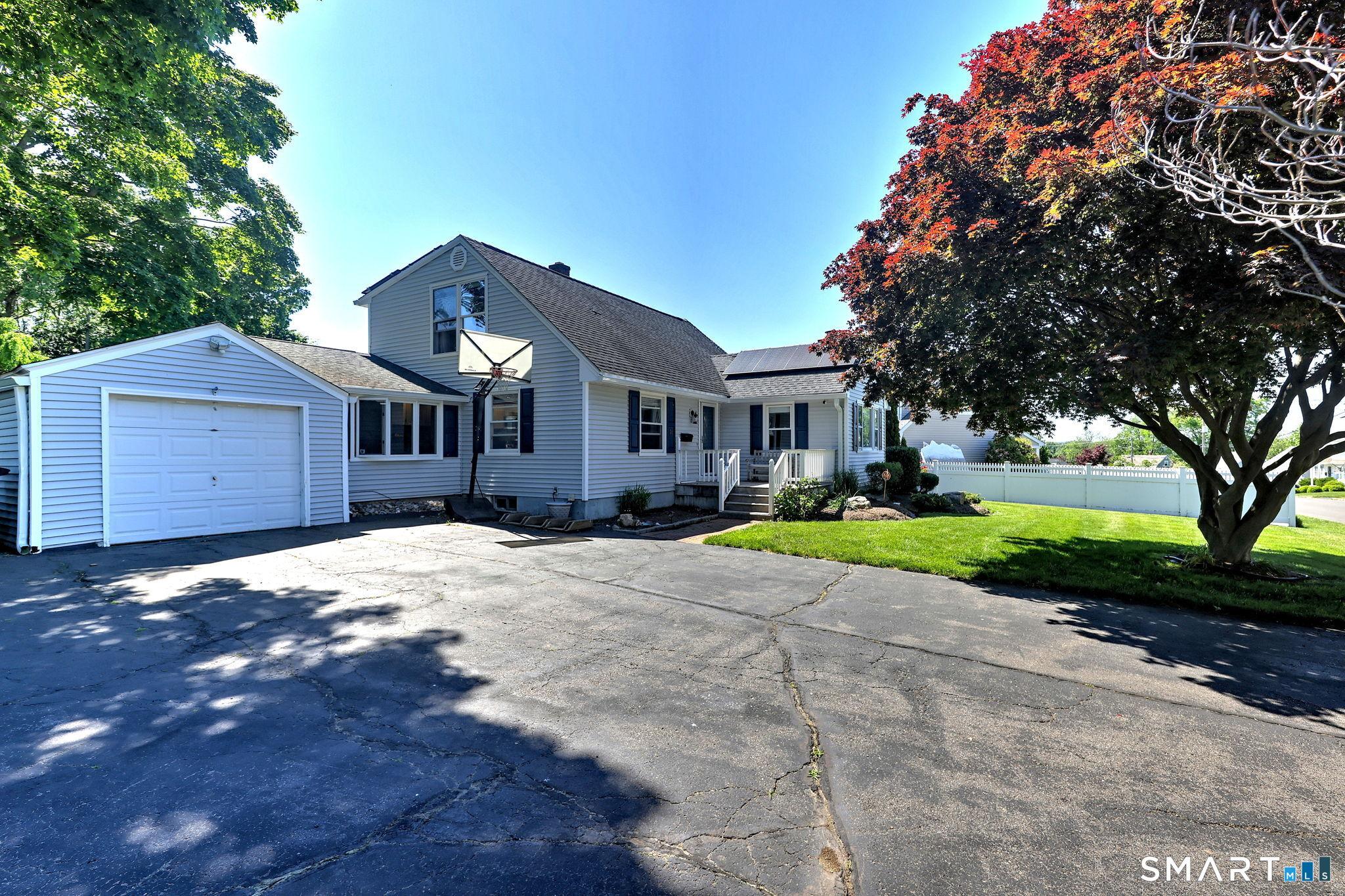 Image 3: large driveway and 1 car garage offers ample parking