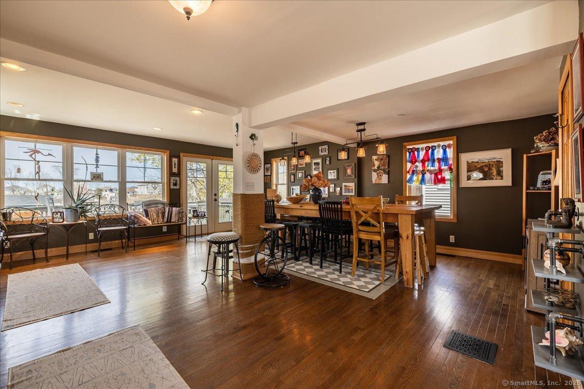 Image 4Dining Area: View from the kitchen/prep area towards the dining/sitting area and the back deck.