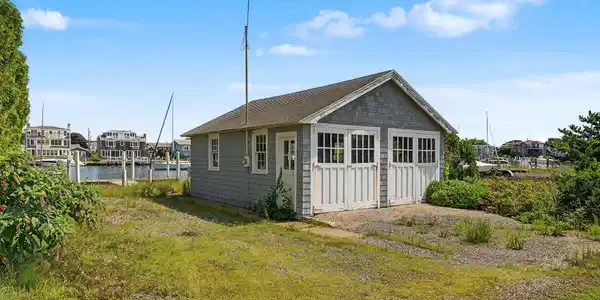 Image 4: This property features a two car garage which could also serve as a home office.