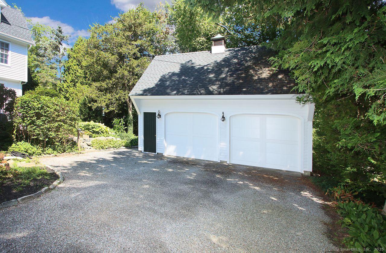 Image 3: Two car detached garage with finished space above