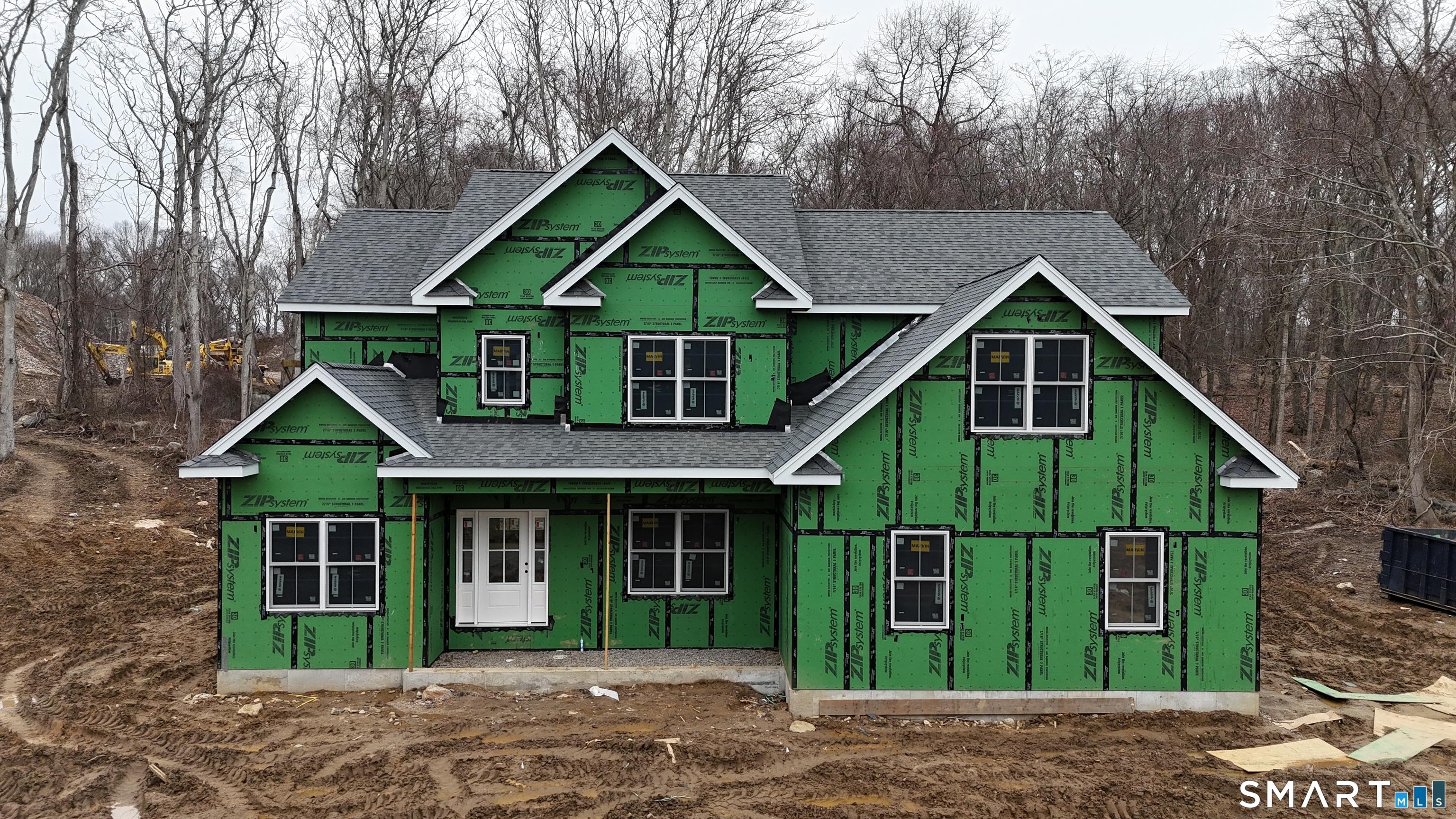 Image 4Front of House: Looking at the Ashton after roof, doors and windows have been installed.