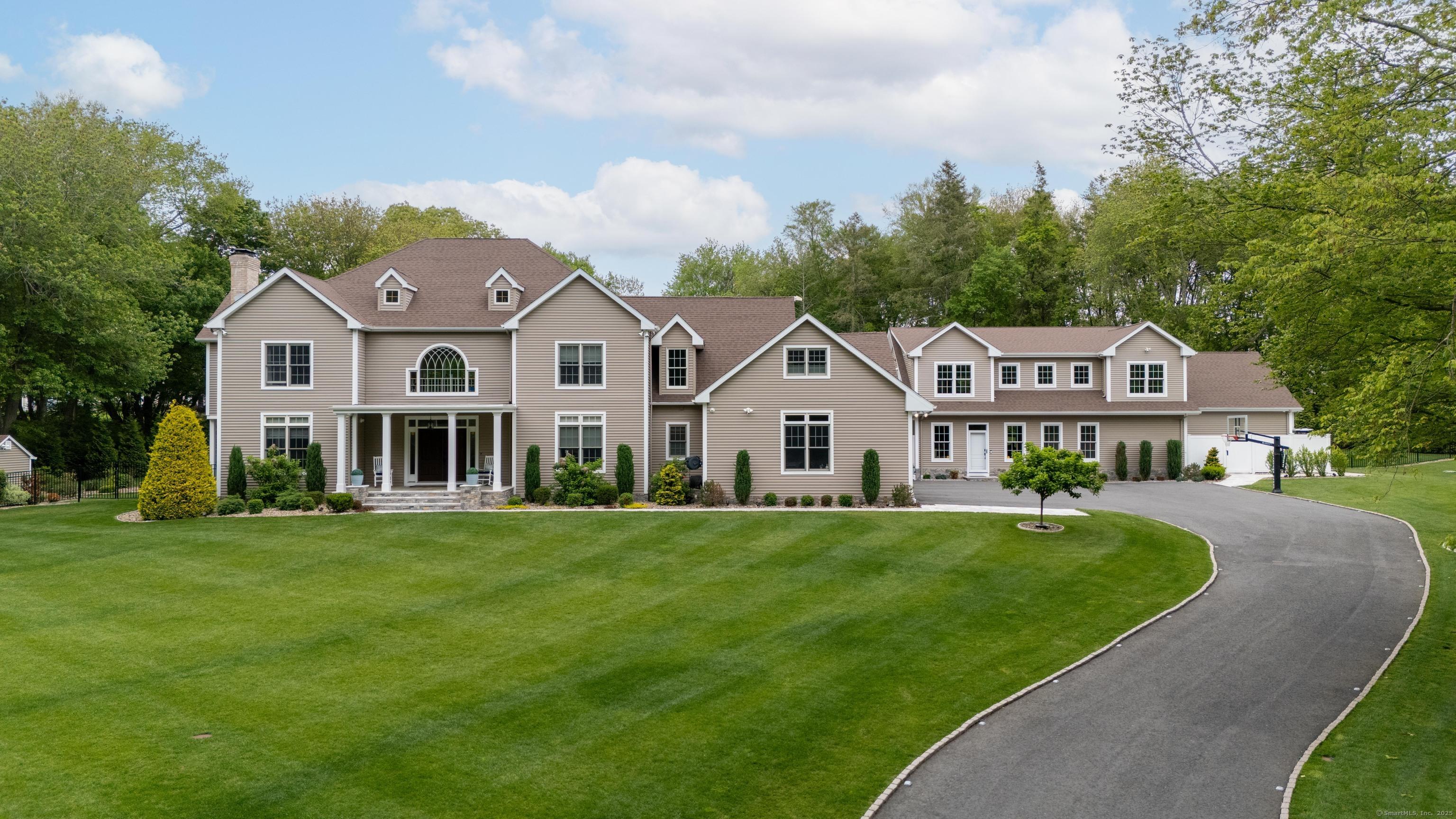 Image 1Front of House: Step inside this enchanting home, where expansive spaces and luxurious comforts create the ultimate setting for unforgettable entertainment and serene living.