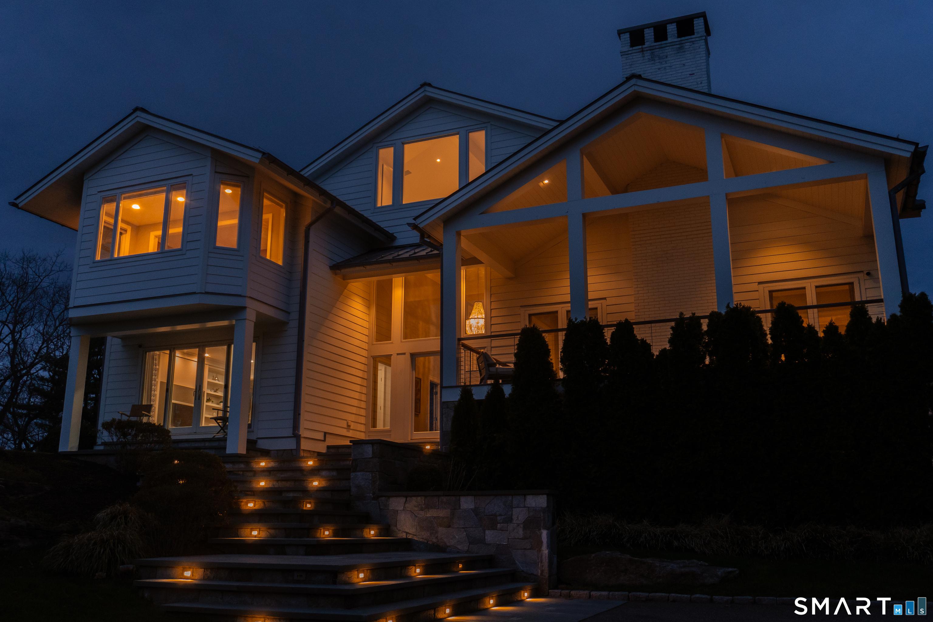 Image 1Front of House: beautiful lighting built into the stone