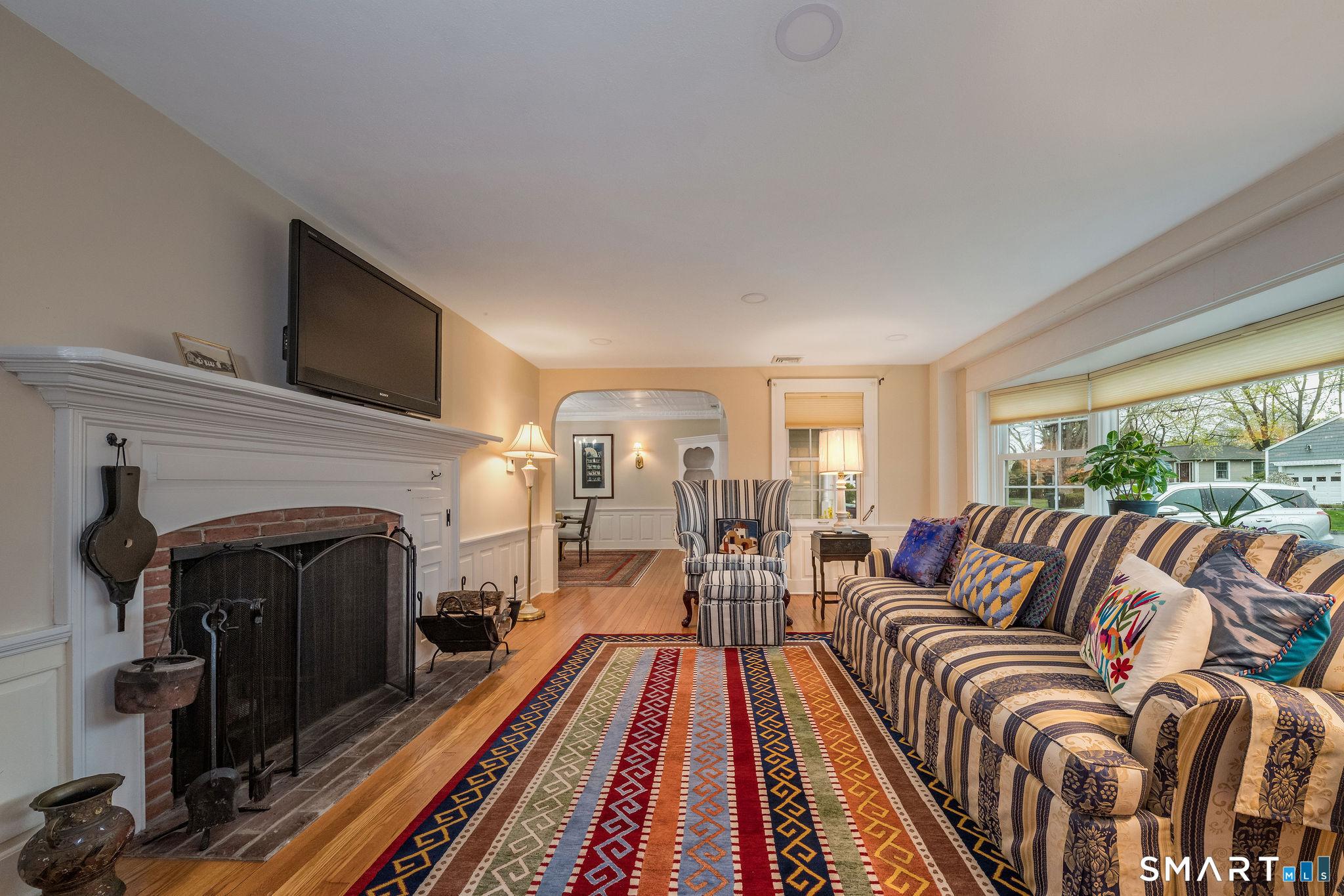 Image 4Living Room: Living room has new bay window and cozy wood fireplace