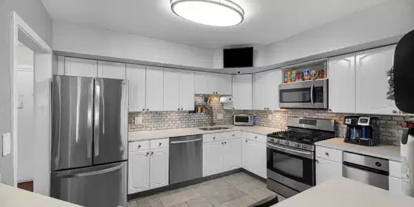 Image 2Kitchen: Remodeled with granite counters, stainless appliances and a breakfast bar that over looks the living room.