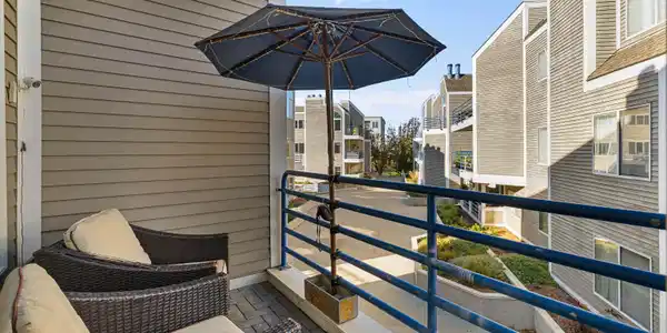 Image 4Balcony: This balcony is off of the living/dining area and during winter you have water views of the inlet.