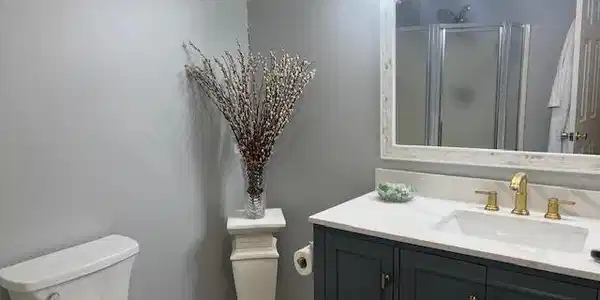 Image 4Bathroom 1: The primary bath has been updated with a new vanity, mirror, lighting and fresh paint.